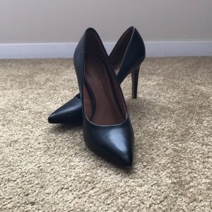 Black pointed toe pumps